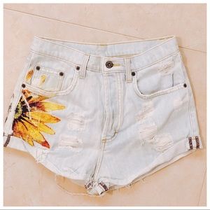 Mid-to-high rise light denim shorts